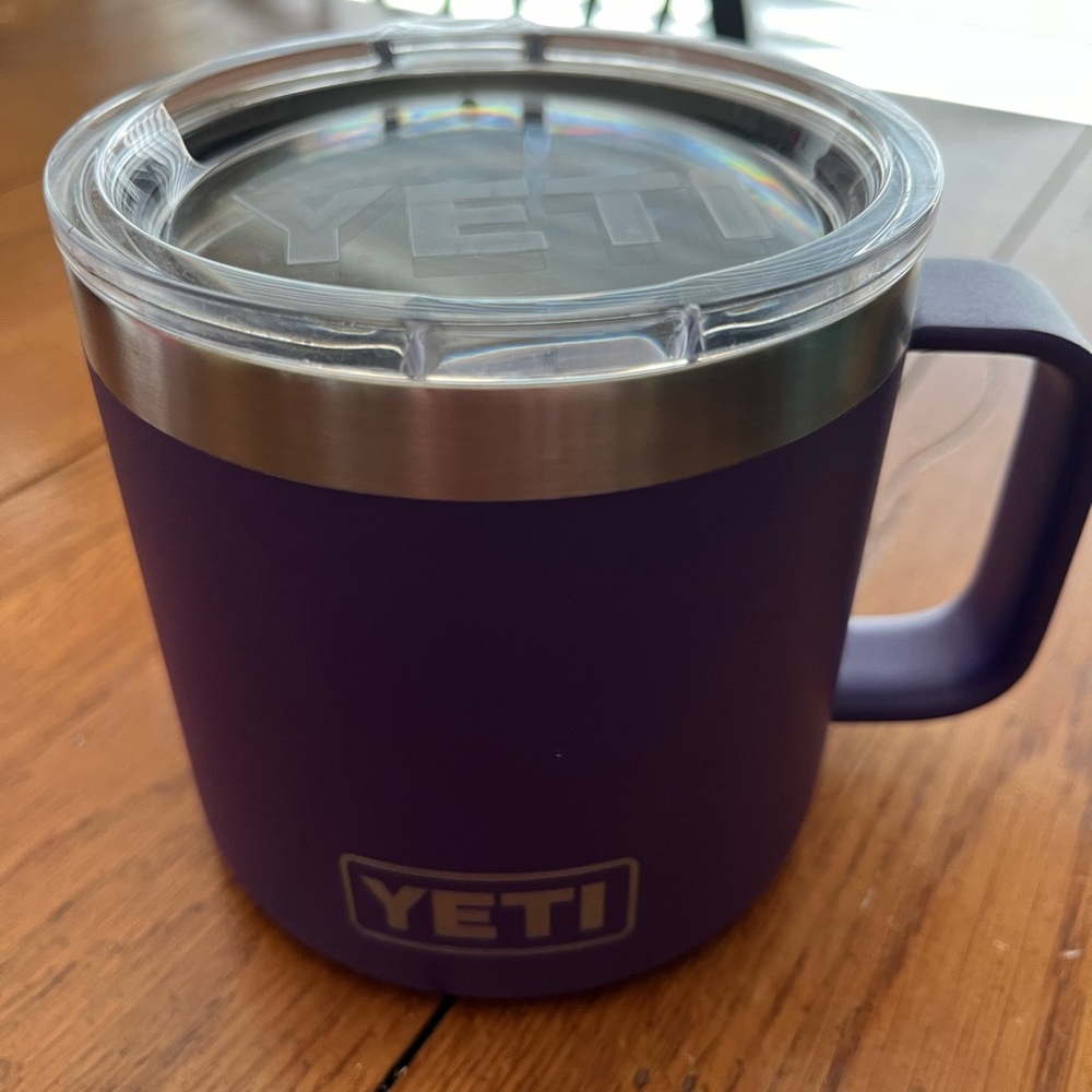 Yeti purple 14 ounce Rambker cup with handle.